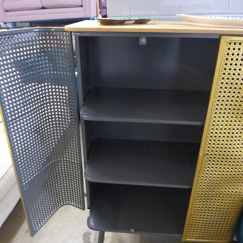 1521 - A gold rattan effect industrial style cabinet