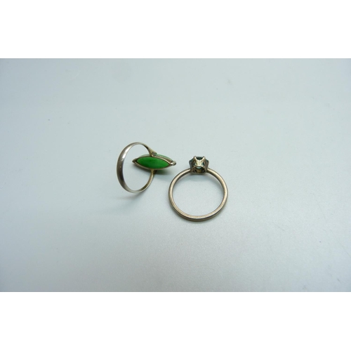 1000 - A Chinese jade ring and one other ring, K and O