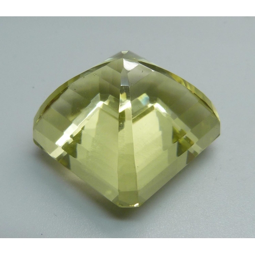 1002 - A large unmounted lemon coloured stone, 30.4g, 28mm x 28mm