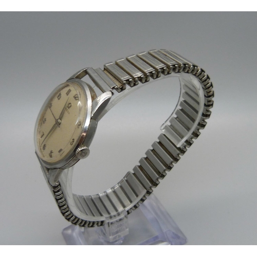 1021 - A 1960's gentleman's Omega wristwatch, the case back bears inscription dated 1961, with other Omega ... 