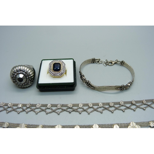 1029 - A pair of silver earrings and a brooch, a silver bracelet, a silver posy holder, a tigers eye set ne... 