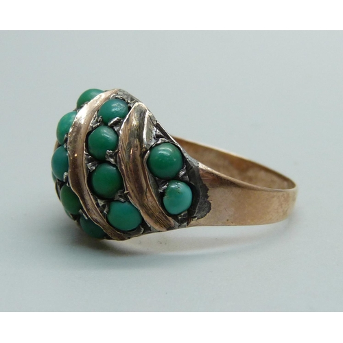 1030 - A yellow metal ring set with turquoise, 6.1g, O