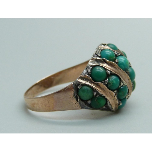 1030 - A yellow metal ring set with turquoise, 6.1g, O