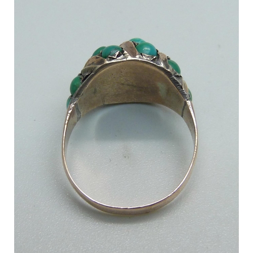 1030 - A yellow metal ring set with turquoise, 6.1g, O