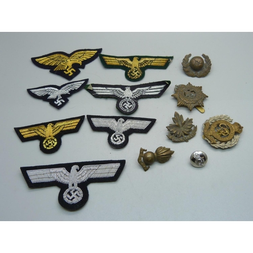 1039 - Seven German cloth insignias and military badges