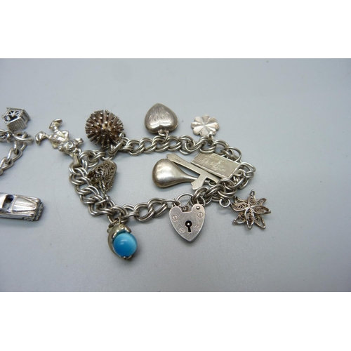 1041 - Two silver charm bracelets, one with 'vampire slaying chest charm', 58g