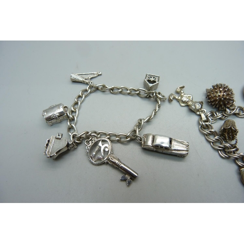 1041 - Two silver charm bracelets, one with 'vampire slaying chest charm', 58g