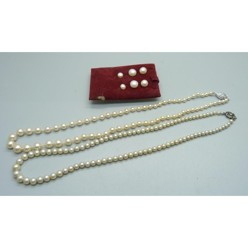 1047 - Three pairs of cultured pearl earrings and two silver mounted strings of pearls