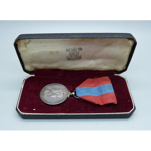 1055 - An Imperial Service Medal, William John Brooks, with letter, cased