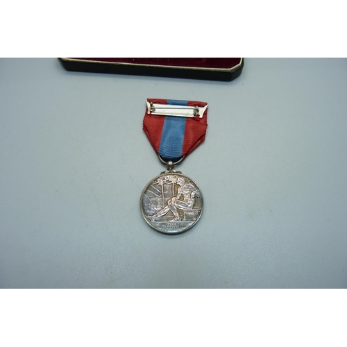 1055 - An Imperial Service Medal, William John Brooks, with letter, cased