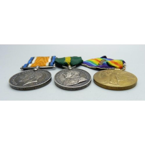 1062 - A group of three medals including Territorial Force Effificency Medal to 375104 W.O. CL 2 R. Arundal... 