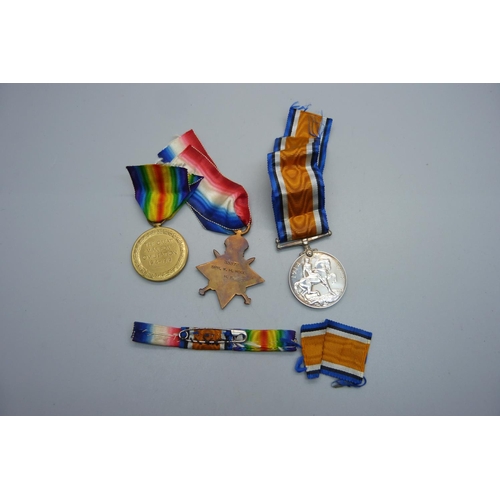 1063 - A pair of WWI medals to 33372 Spr. W.H. Wood, R.E., and a British War Medal to 152568 Gnr. J.W. Huts... 