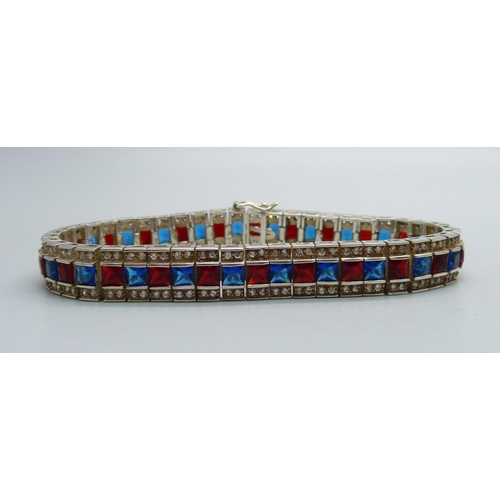 1073 - A silver white, red and blue stone bracelet