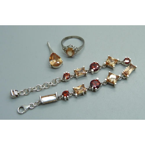 1074 - A silver and citrine pendant, bracelet and ring set, ring size Q