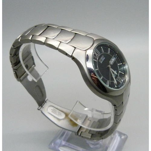 1079 - A gentleman's Citizen Eco Drive Calendar 100MT CLC titanium wristwatch, E101-K18434