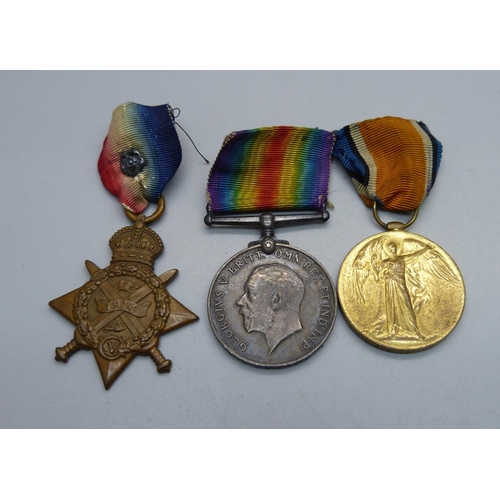 1094 - A set of three WWI medals including 1914 Mons Star to 8608 Pte. J. Davies, 1/R, W. Fus with rosette