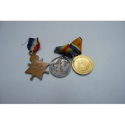 1094 - A set of three WWI medals including 1914 Mons Star to 8608 Pte. J. Davies, 1/R, W. Fus with rosette