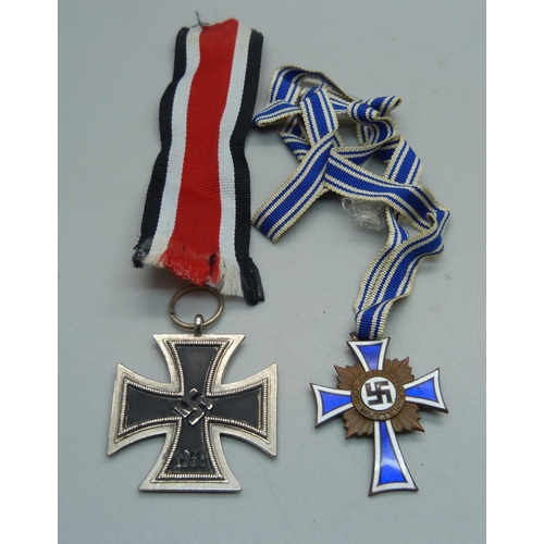 1095 - A German enamelled Mothers Cross Medal and one other cross medal