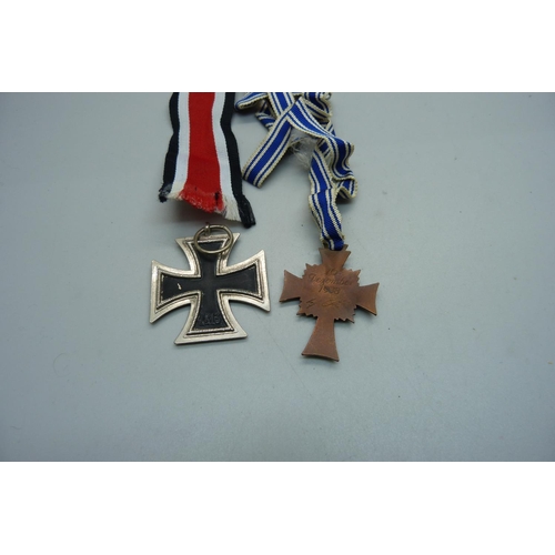 1095 - A German enamelled Mothers Cross Medal and one other cross medal