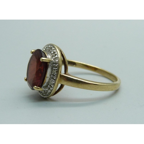 1097 - A 9ct gold, red and white stone set ring, 2.8g, P