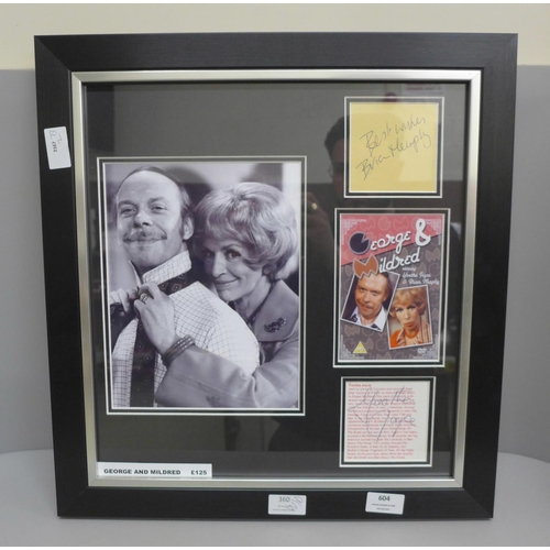 604 - A framed autograph display, Brian Murphy and Yootha Joyce, with Universal Autograph Club certificate... 