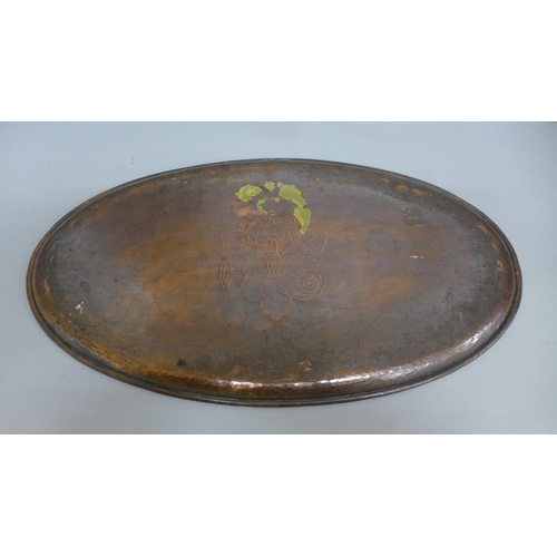 606 - A Hugh Wallis oval copper tray, 43cm