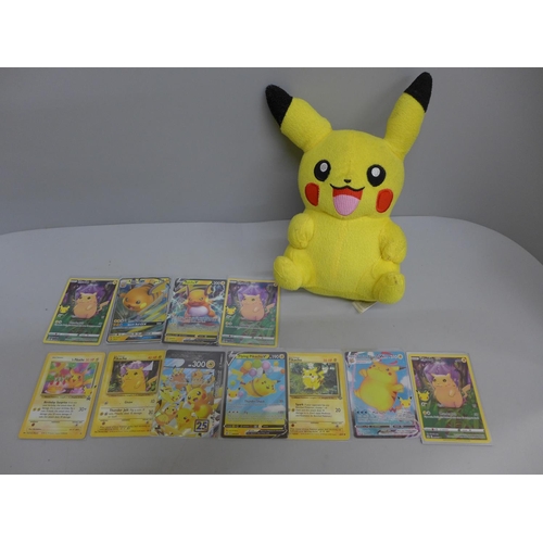 611 - Pikachu and Raichu Pokemon cards and a Pikachu plush toy