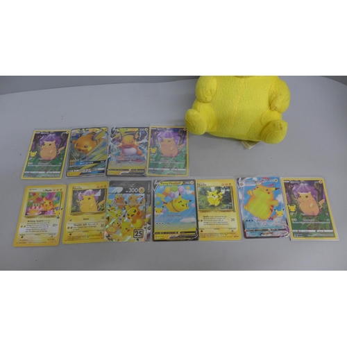 611 - Pikachu and Raichu Pokemon cards and a Pikachu plush toy