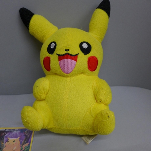 611 - Pikachu and Raichu Pokemon cards and a Pikachu plush toy