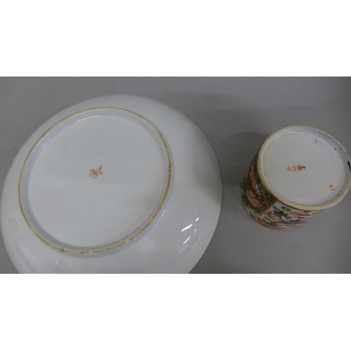 614 - An 18th Century Derby porcelain dish and a cup, chip on the rim of the dish