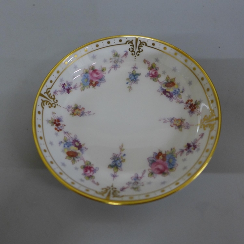 615 - A Royal Crown Derby 1128 pattern cup and saucer and a Royal Antoinette pattern pin dish