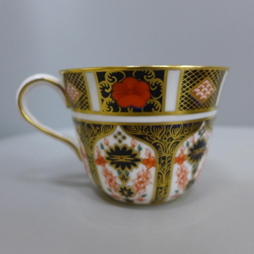 615 - A Royal Crown Derby 1128 pattern cup and saucer and a Royal Antoinette pattern pin dish