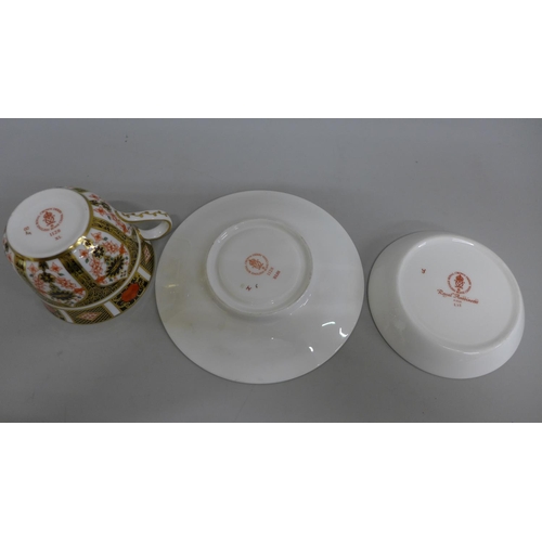 615 - A Royal Crown Derby 1128 pattern cup and saucer and a Royal Antoinette pattern pin dish