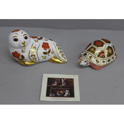 620 - Two Royal Crown Derby paperweights, seal and tortoise, both seconds and lacking stoppers