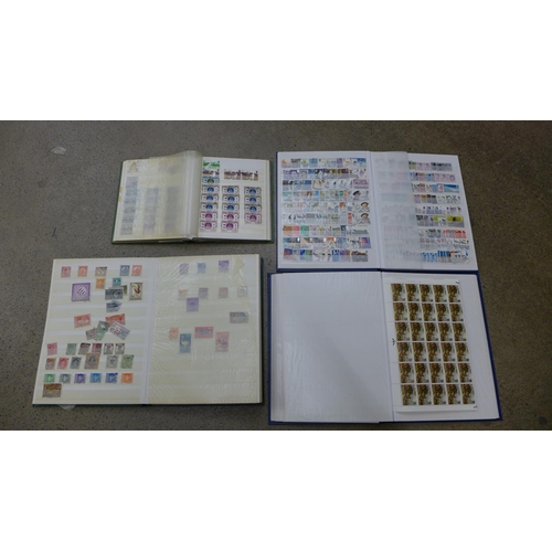 643 - Four albums of British stamps