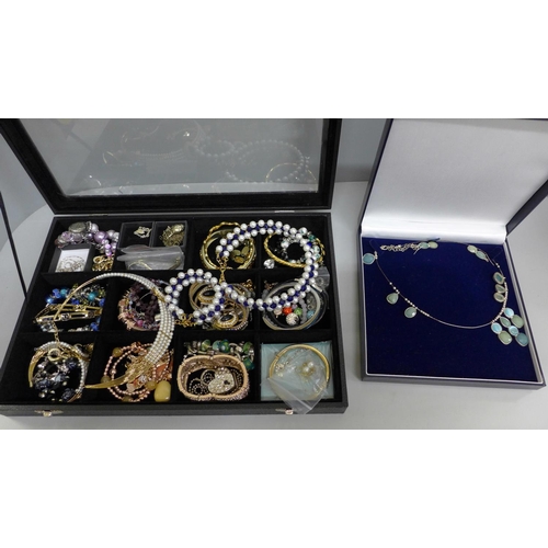 655 - Costume jewellery and a display case