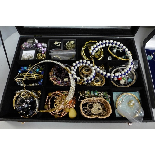 655 - Costume jewellery and a display case