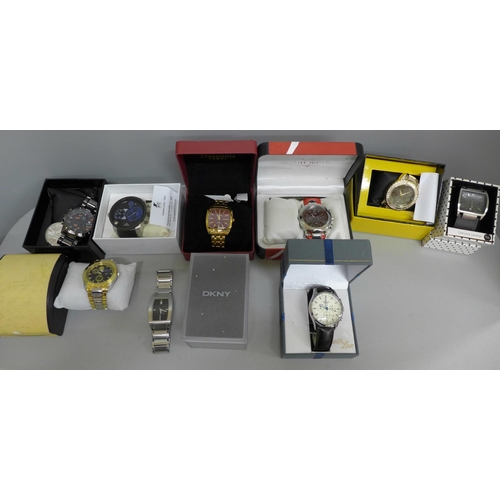 660 - A collection of boxed fashion wristwatches