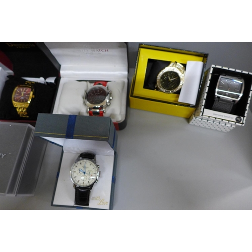 660 - A collection of boxed fashion wristwatches