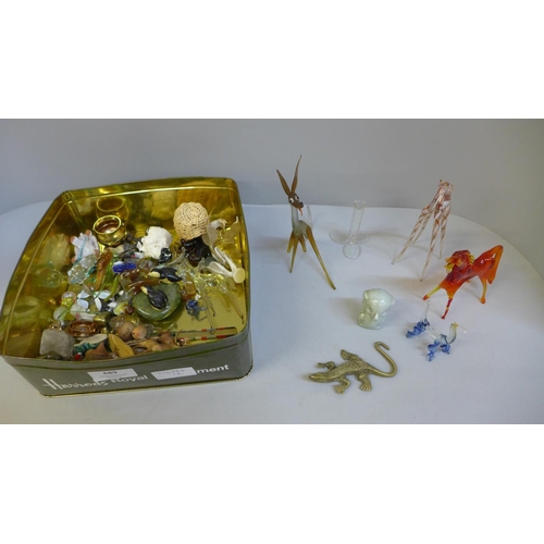 689 - A tin of glass animals, whimsies, ceramic figures, etc.