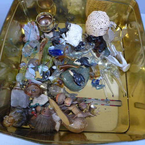 689 - A tin of glass animals, whimsies, ceramic figures, etc.