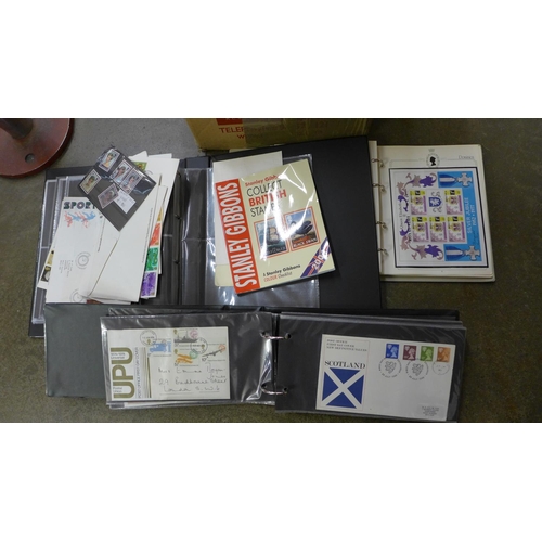 693 - A collection of first day covers, mostly in albums and a quantity of loose stamps