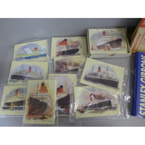 734 - A collection of maritime postcards and two stamp reference books