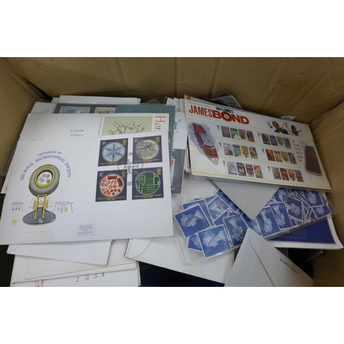 746 - A collection of first day covers, postcards etc. mostly in albums and a quantity of loose stamps