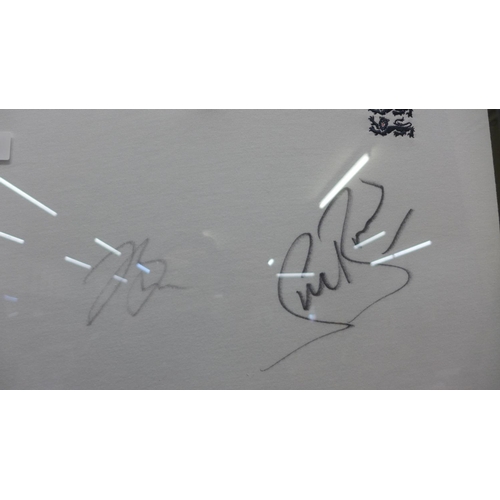 760 - A framed autograph display, England Waitrose Sponsored cricket shirt, Stuart Broad and Jake Bell, wi... 