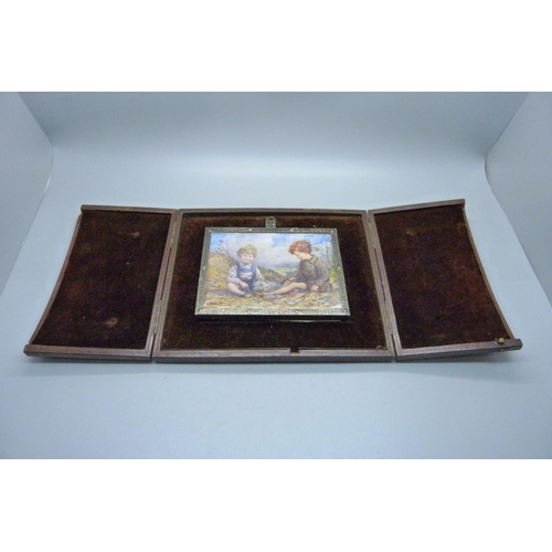 824 - A painting on vellum of two boys by Elizabeth Brockbank, framed and in original case