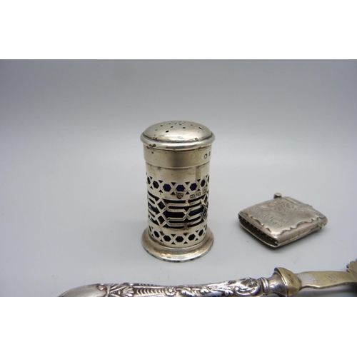 839 - A silver vesta case, a Victorian silver pepper and a fork with silver covered handle