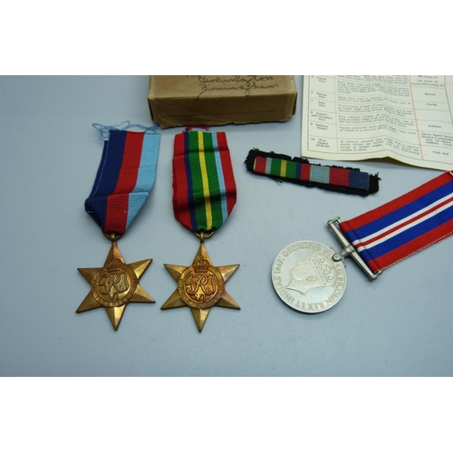 852 - Three WWII medals with ribbons, paper and box addressed to Mr D.L. Barnett, Birmingham