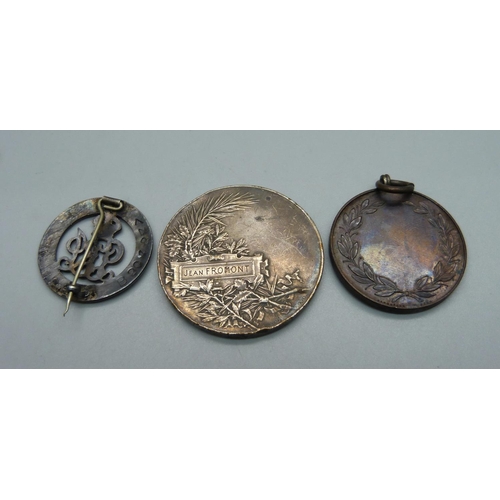 869 - A French white metal medallion, a Woman's Own Cookery medal and a silver wound badge numbered B20484... 