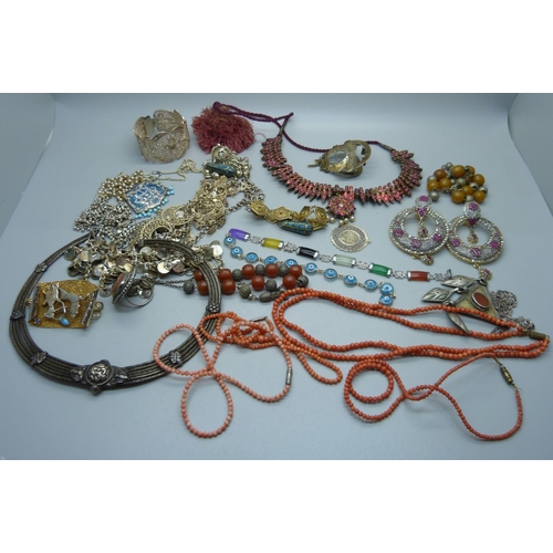 878 - A collection of Eastern white metal jewellery, a coral necklace, etc.